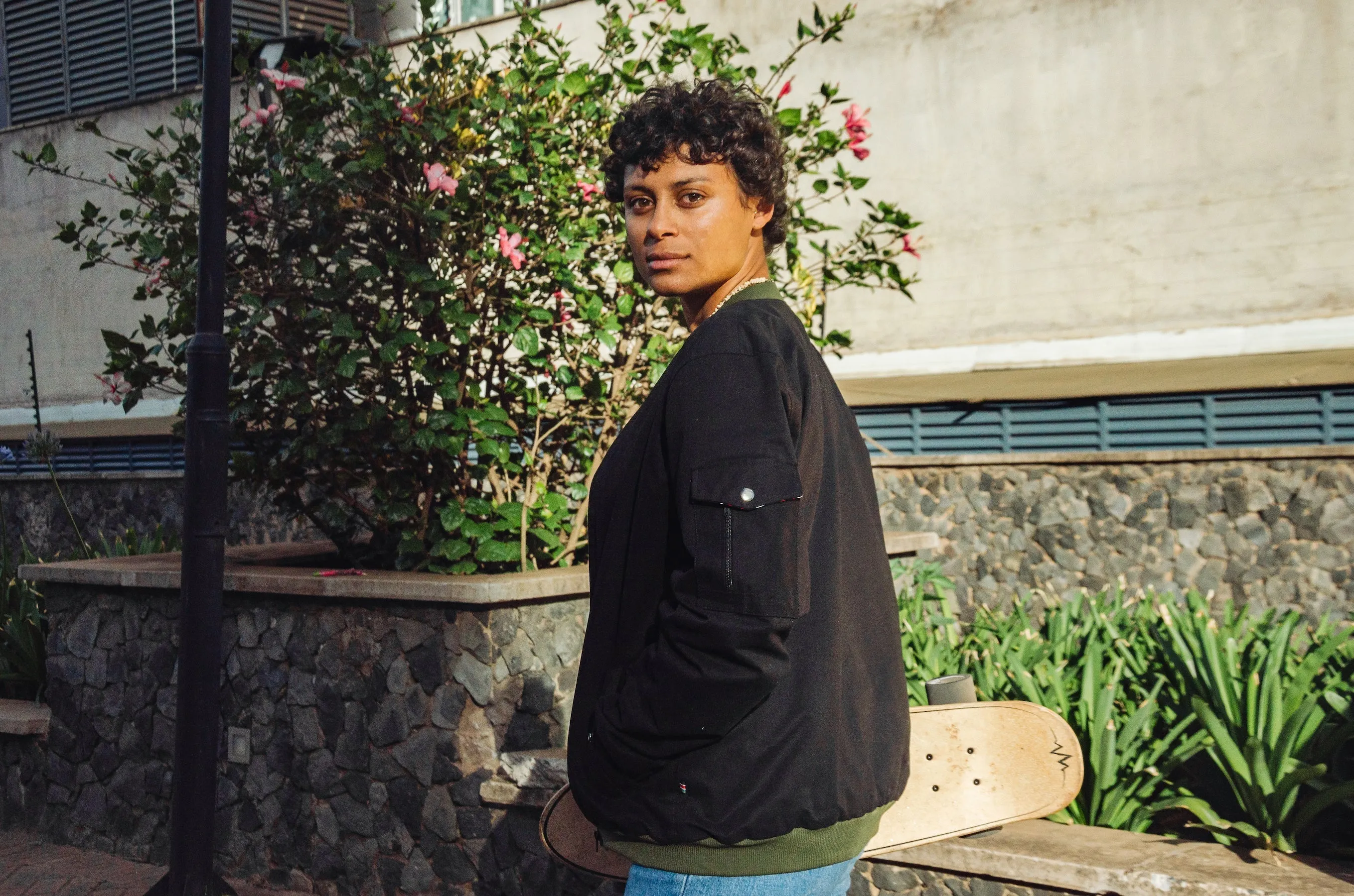 Mikono Black bomber jacket with four shoulder pockets and one inside pocket