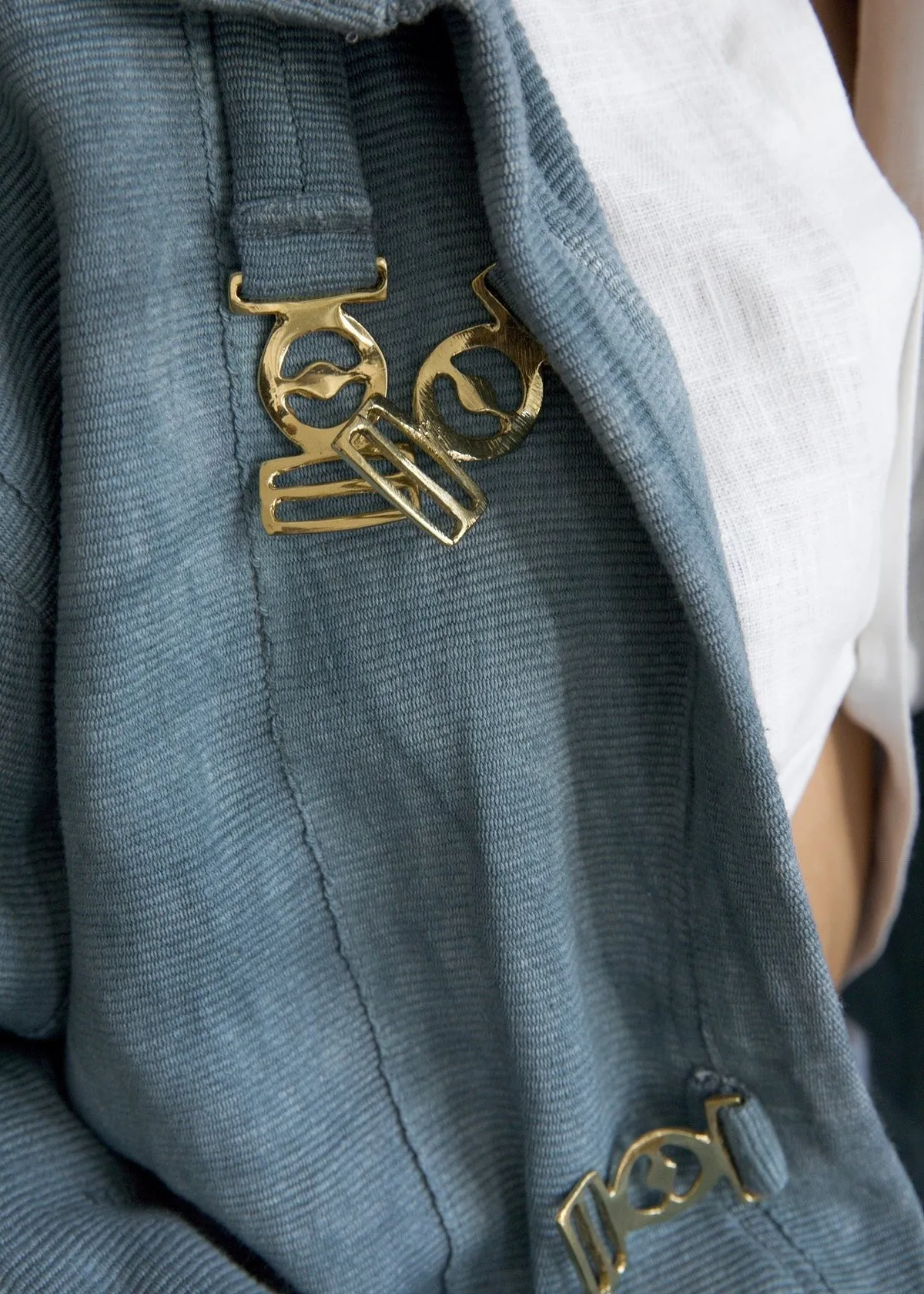 Olooh Momo oversized Short high collar Jacket with strap closures on the front